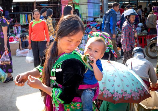 Woman walking with her baby